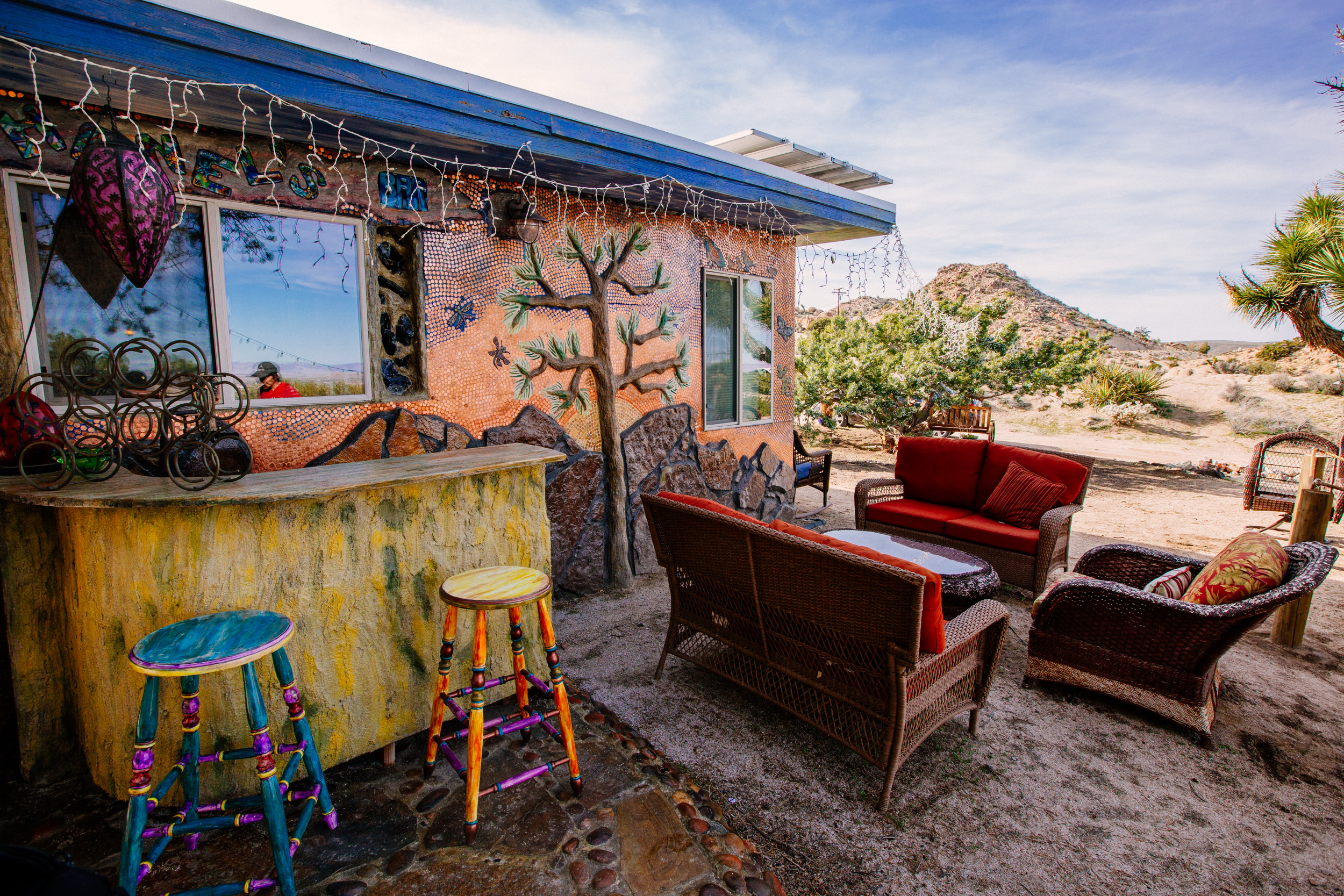 Dream Catcher lounge and bar area with a penny mosaic mural